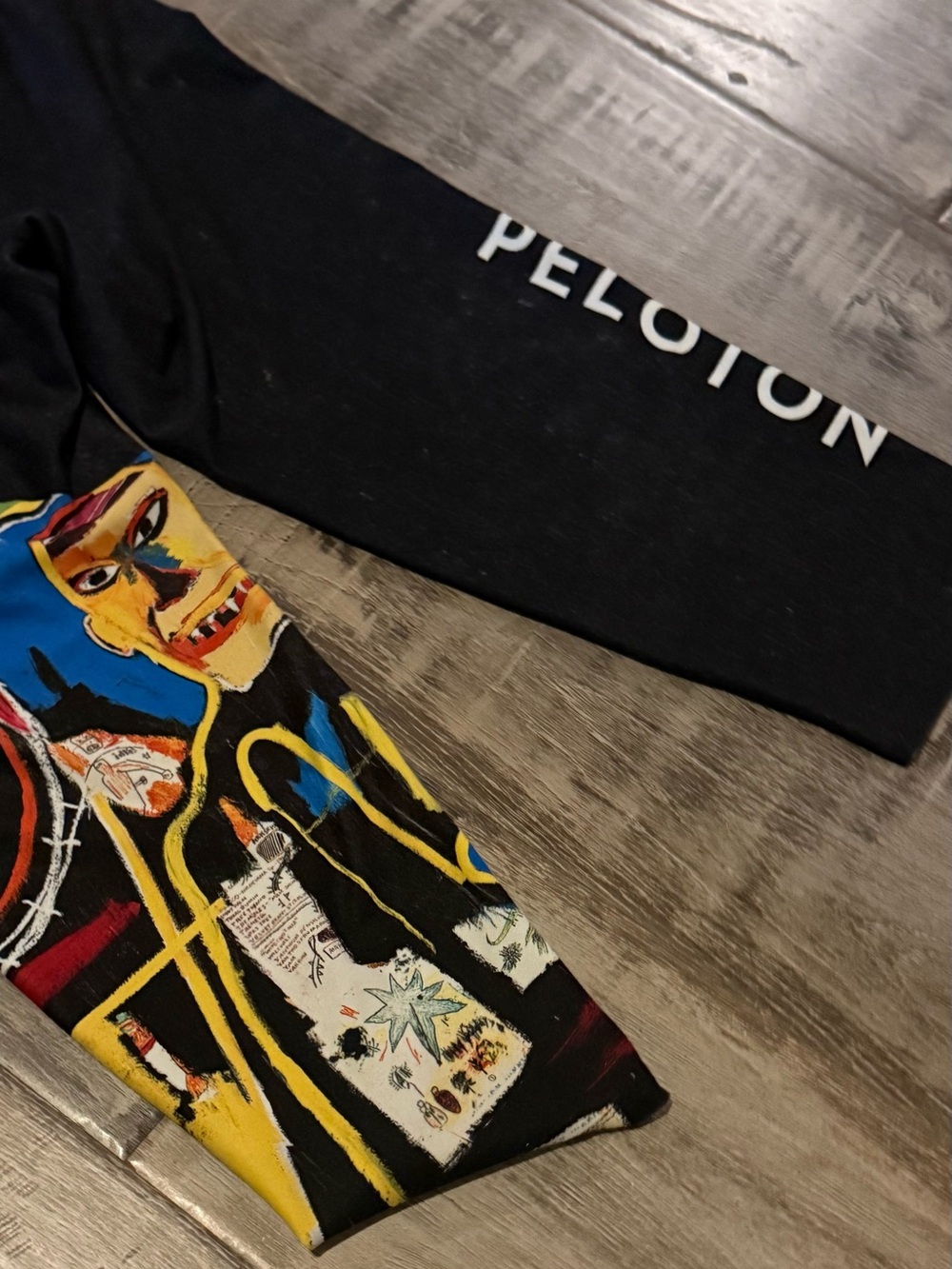 Peloton mid length work out tights. Official Michel Basquiat graphic.